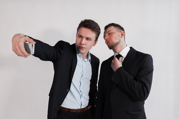 The businessmen taking a selfie on white background