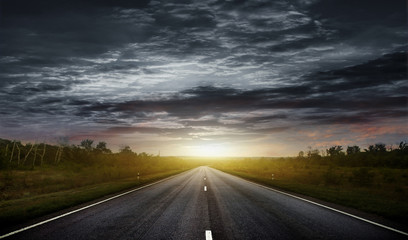 Naklejka premium Country road with a dark sky