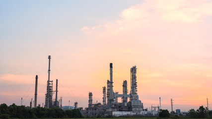 Obraz na płótnie Canvas Oil refinery plant at sunrise with sky background