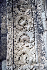 sculpted stone depicting a dinosaur at the ancient Ta Prohm temp
