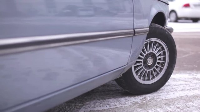 Сamera moves to the wing on the car wheel