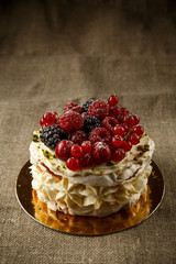 Pavlova, a home made cake from layers of meringue, whipped cream, and fresh berries