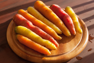raw colorful carrot vegetable on wooden background