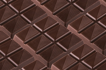 Smal piece of chocolate bar  isolated at white background