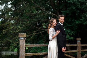 happy bride and groom at a park on their wedding day