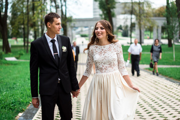 happy bride and groom at a park on their wedding day