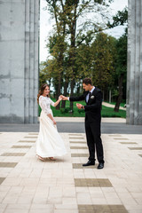 happy bride and groom at a park on their wedding day