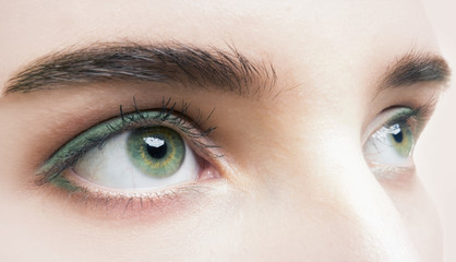 Obraz premium Close up photo of woman's green eye