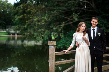 happy bride and groom at a park on their wedding day