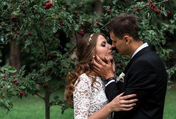 happy bride and groom at a park on their wedding day