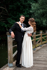 happy bride and groom at a park on their wedding day