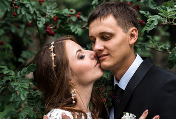 happy bride and groom at a park on their wedding day