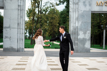 happy bride and groom at a park on their wedding day