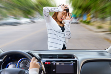 Young shocked woman screaming when being crushed by fast car - obrazy, fototapety, plakaty