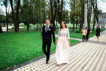 happy bride and groom at a park on their wedding day