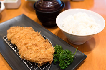 soft focus of japanese fried pork (tonkatsu) served with rice and tofu soup