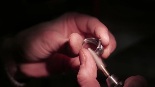 Jewelry work. Processing of silver ring. Close-Up. 4K UHD
