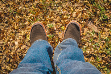 Human stand on the natural ground .