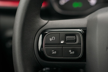 Volume level control on the steering wheel.