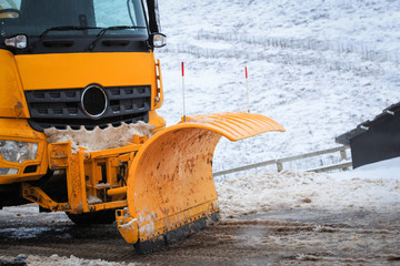 Snow Plough clearing snow from a road.