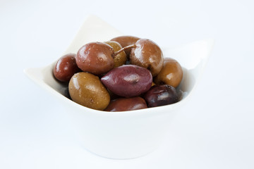 A small bowl with different types of olives