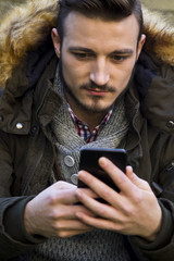 Young man with mobile phone