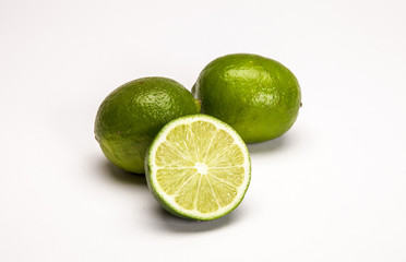 Whole fresh lemons and matches on white background