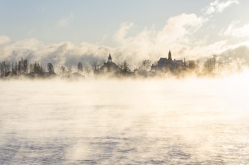 Island behind vaporing sea