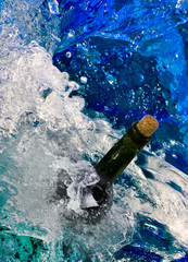 bottle with letter in sea water close up.