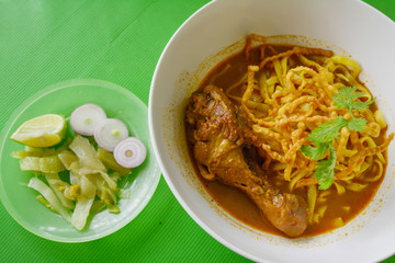 Curried Noodle Soup (Khao soi) with chicken , Traditional of Northern Thai food.