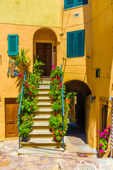 Fototapeta na wymiar House with flower of Capoliveri village in Elba island, Tuscany, Italy, Europe.