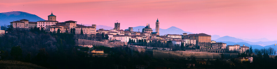 Bergamo Alta old town colored af sunset's lights - Lombardy Italy - obrazy, fototapety, plakaty
