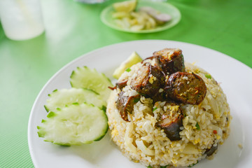 Fried rice with Thai spicy sausages Northern style.on green table