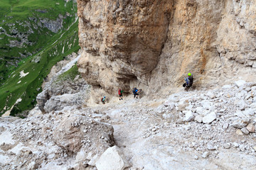 People climbing the Via Ferrata Severino Casara in Sexten Dolomites mountains, South Tyrol, Italy