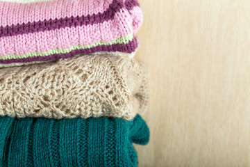 Fototapeta na wymiar Stack of wool knitted sweaters