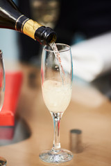 bottle of champagne with glass