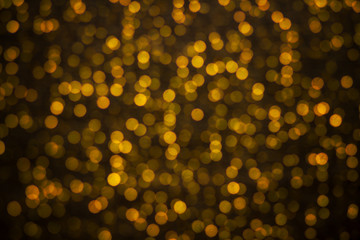 Abstract backgroung of golden glitter and glow soft  bokeh shini