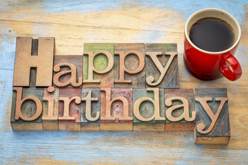 Happy Birthday in wood type with coffee