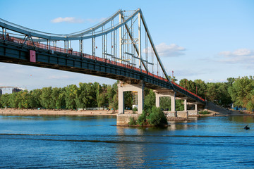Riverscape in sunny day in Kiev, Ukraine. Peshehodniy most