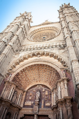 Fototapeta na wymiar Catedral de Santa Maria de Palma de Mallorca one of the main sights of the Majorca island. Vertical image the main entrance to the Cathedral.