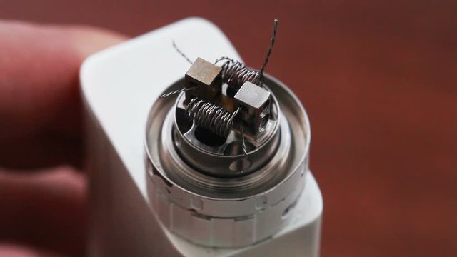 Macro video of burning spiral electronic cigarette
