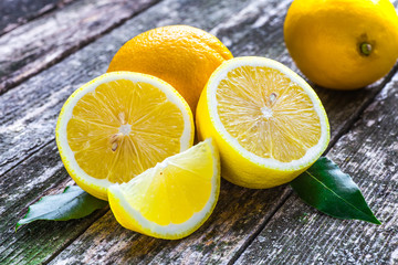 Pile of lemons on wooden table