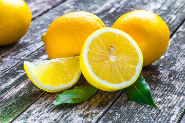 Pile of lemons on wooden table