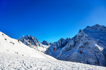 Fototapeta na wymiar Ski lift in Ski Resort high in the mountains in Russia