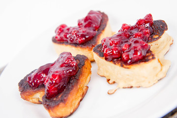 Heart shaped pancakes with cowberry jam