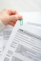 Female hands and tax form