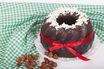 Tasty chocolate cake on a light background