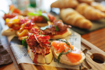 Classic Spanish tapas cooked for the visitors of the event on a wooden board.