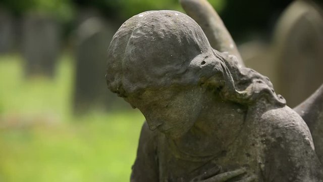 Sad Angel on a graveyard in England