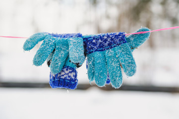 knitted winter gloves of a rope
